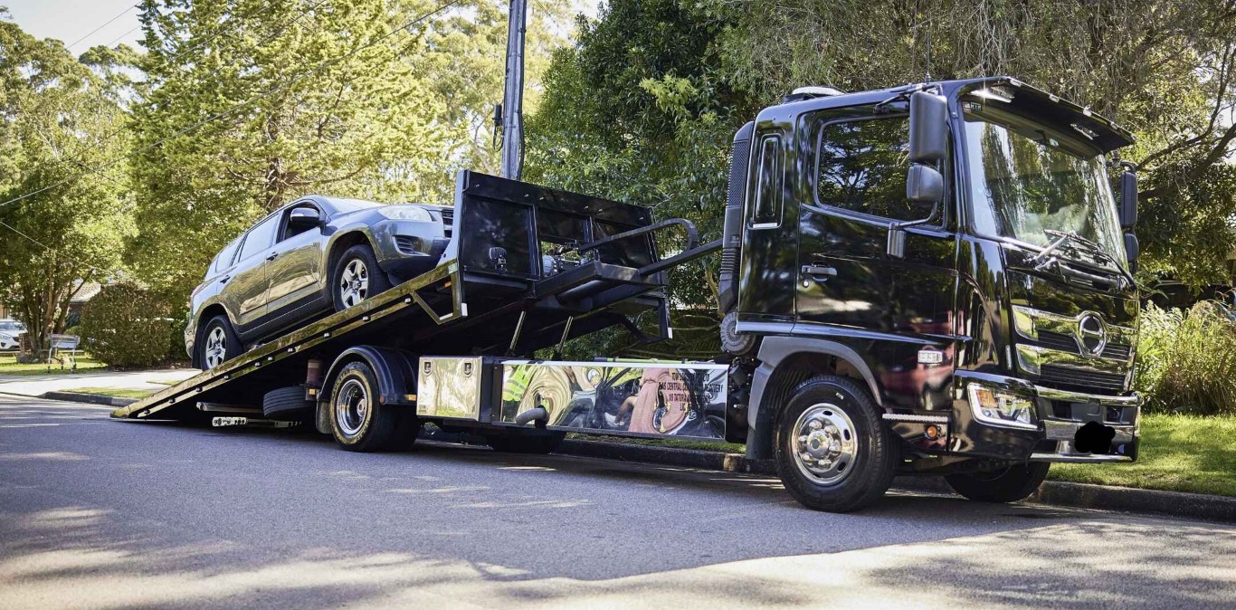 Motorcycle towing on a flatbed truck in Bay Shore, NY